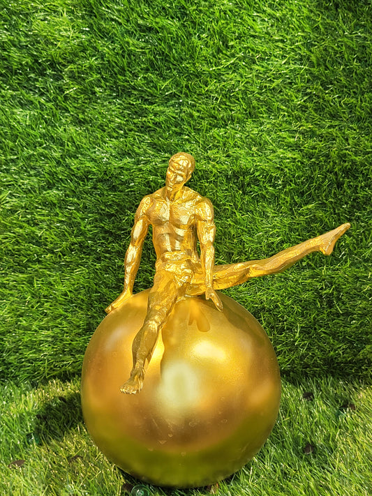 Golden Gymnast on Sphere Sculpture